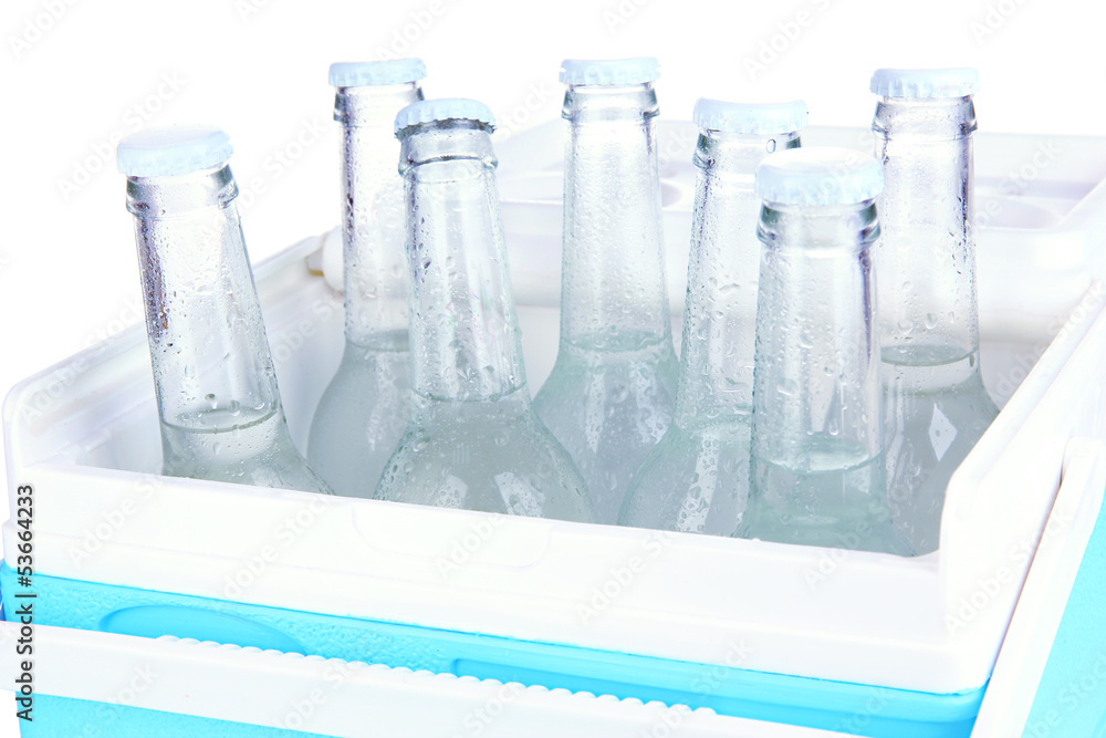 Traveling refrigerator with water bottles isolated on white