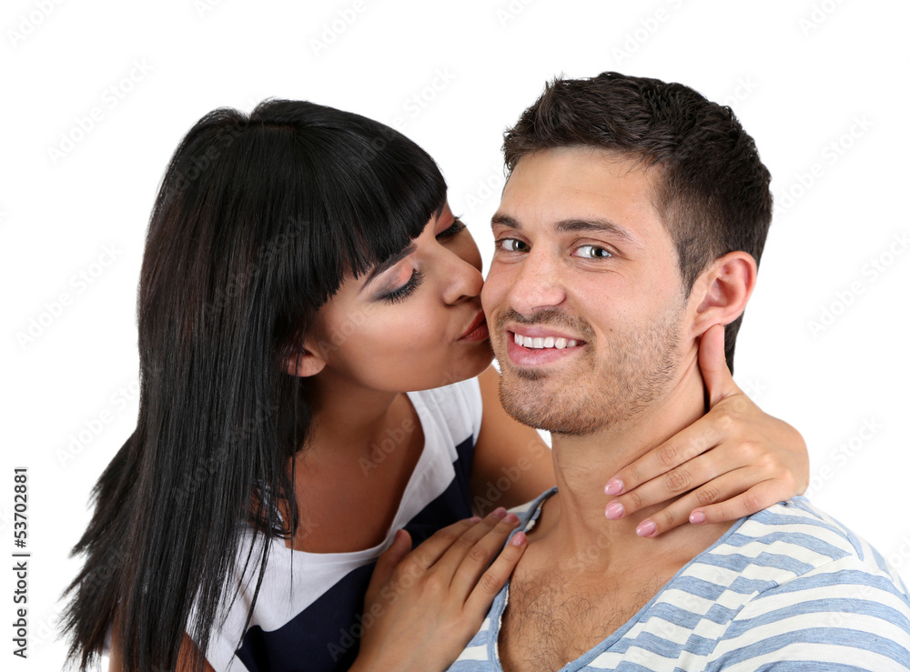 Beautiful loving couple kissing isolated on white