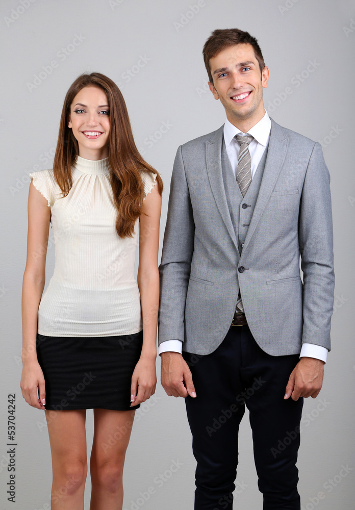 Business colleagues on grey background