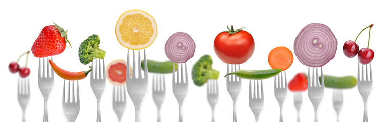 diet concept.vegetables and fruits on the collection of forks