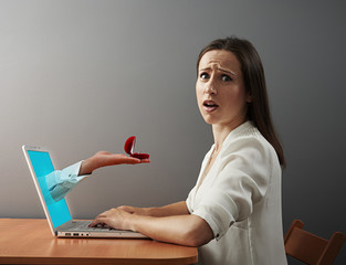 confused young woman looking at camera