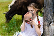 © stormy - Young happy womman drinking fresh milk near cows