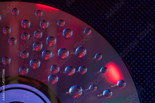 Naklejka - mata magnetyczna na lodówkę Abstract music background, water drops on CD/DVD