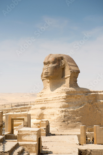 Fototapeta na wymiar Famous ancient statue of Sphinx in Giza, Egypt
