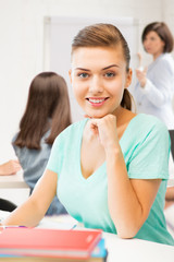 Canvas Print - happy smiling student girl with books at school