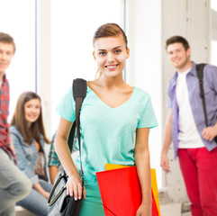 Canvas Print - student girl with school bag and color folders