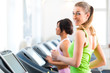 © Kzenon - People in sport gym on treadmill running