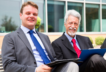 Wall Mural - Two business men partner talking about project