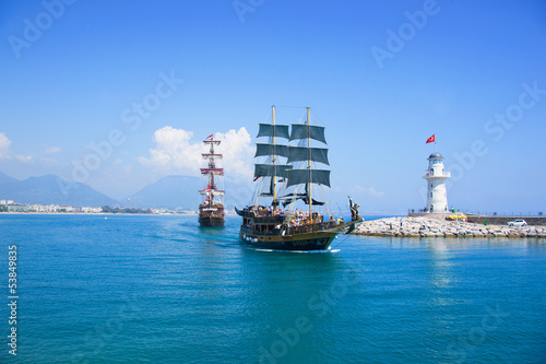 Naklejka na szybę Tourists enjoying sea journey on vintage sailships in Alanya, Tu