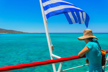 Greece elafonisos tourist enjoying the view of the sea at summer