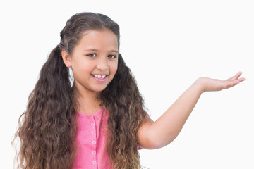 Little girl presenting something