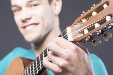 Happy Young Man With Guitar