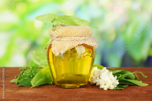 Fototapeta do kuchni Jar of honey with flowers of lime, acacia