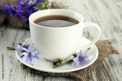 Naklejka nad blat kuchenny Cup of tea with chicory, on wooden background