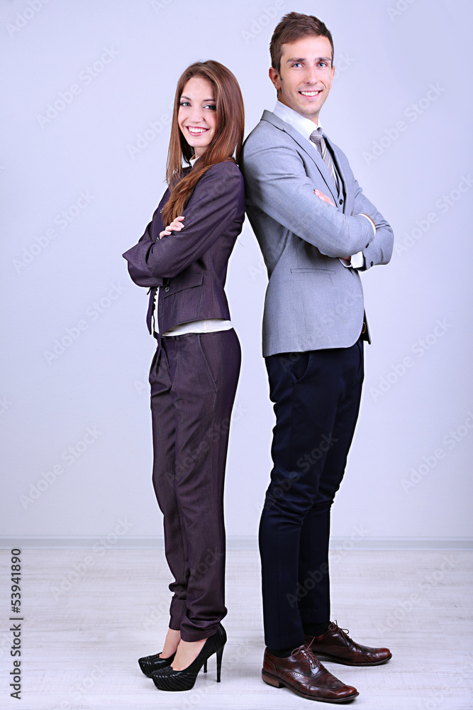 Successful business people on grey background