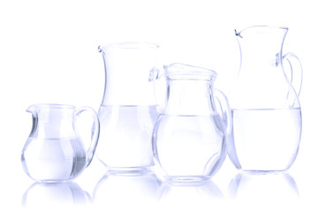 Canvas Print - Glass pitchers of water isolated on white