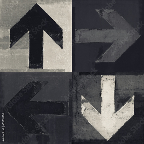 Four arrows signs painted on a wall, grunge design arrows set © lava4images