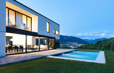 Modern villa with pool, night scene