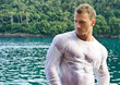 © theartofphoto - Handsome young bodybuilder by the sea with wet shirt on