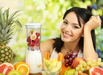 Wall Mural - Girl with fresh fruits on natural background