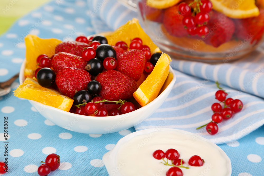 Useful fruit salad in glass cup and bowl