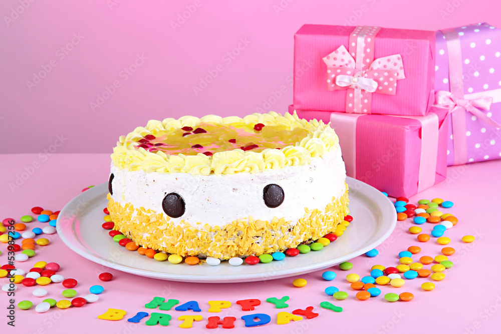Happy birthday cake and gifts, on pink background