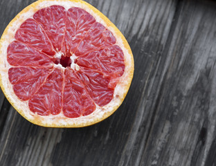 Wall Mural - red grapefruit on old table