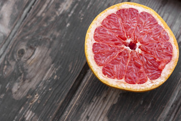 Wall Mural - red grapefruit on old table