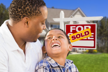 Wall Mural - Mixed Race Father and Son In Front of Real Estate Sign and House