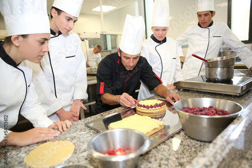 Fotografie, Obraz Students with teacher in pastry training course