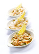three bowls with prawns and garlic butter