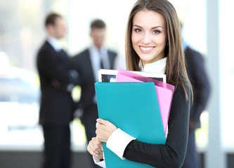 Wall Mural - Face of beautiful woman on the background of business people