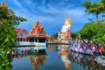 Wall Mural - Thailand travel background. Buddha temple pagoda and beautiful t