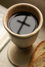 Chalice With Wine, Piece Of Bread And Open Bible.