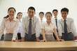 © xixinxing - Office team standing near the desk, portrait