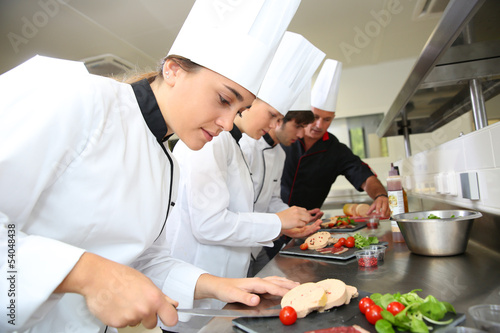 Fotografie, Obraz Team of young chefs preparing delicatessen dishes