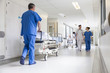 Leinwandbild Motiv Doctors Hospital Corridor Nurse Pushing Gurney Stretcher Bed