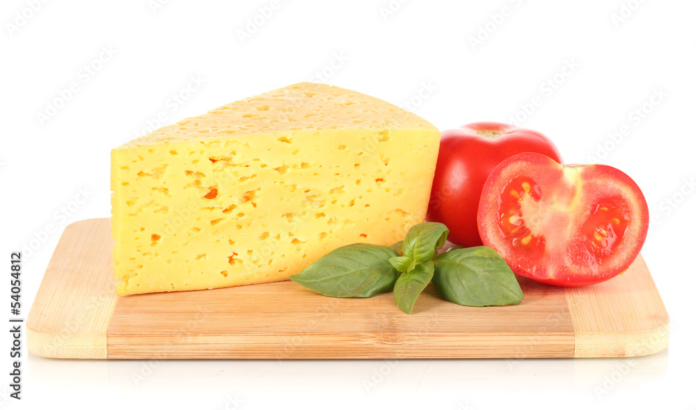 Cheese,basil and tomato on cutting board isolated on white