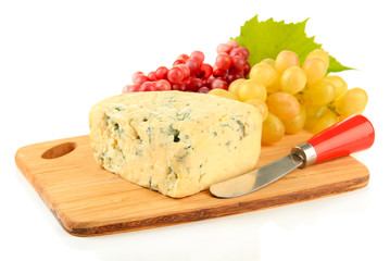 Fototapete - Tasty blue cheese and grape on cutting board, isolated on white
