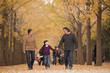 © xixinxing - Grandparents and granddaughter playing in park