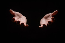 Hands From The Dark. Close-up Of Human Hands Stretching Out From