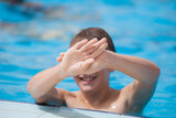 Fototapeta Abstrakcje - boy playing in the pool
