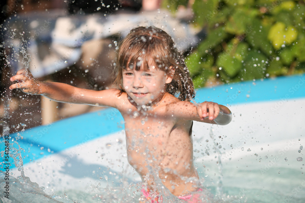 Little girl in swimming pool. Stock Photo Adobe Stock