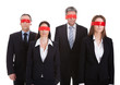 © Andrey Popov - Group Of Business People's Eyes Covered With Ribbon