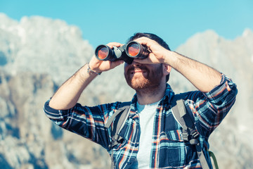 Canvas Print - Young Man with Binocular at Mountain