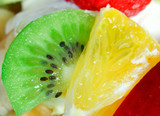 Fototapeta Kuchnia - Fruit salad with a strawberries, orange and kiwi