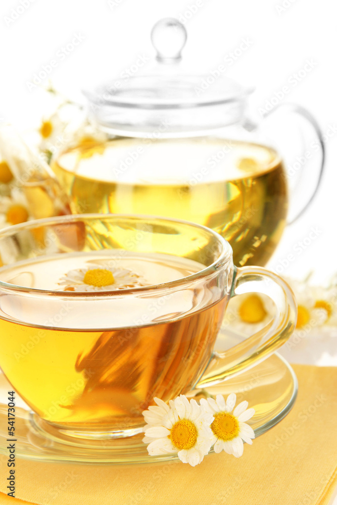 Cup of herbal tea with camomiles close up