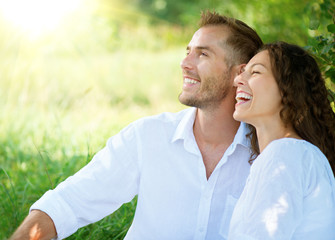 Wall Mural - Happy Smiling Couple Relaxing in a Park