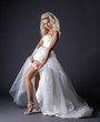 © Wisky - Image of sensual young bride shows garter on leg