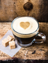 Poster - Small cup of espresso coffee in glass with heart drawning on fo